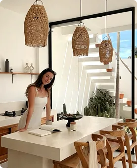 Guest enjoying a relaxed morning in the villa kitchen